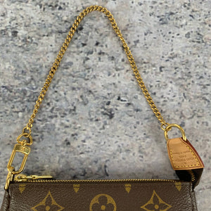 louis vuitton small bag with gold chain